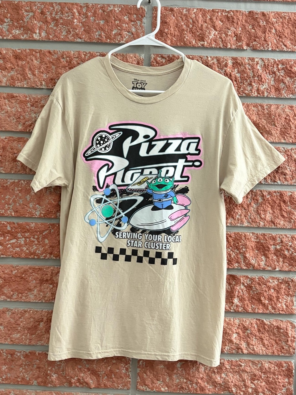 🌟 Toy Story Pizza Planet Beige Graphic Tee